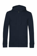 The BA002, a plain dark blue zip-up hoodie from B&C Collection, features a hood with drawstrings. It comes with long sleeves and two front pockets and is showcased against a white background.
