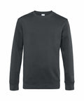 Displayed against a white background, the B&C Collection's BA010 is a plain dark green crew neck sweatshirt featuring long sleeves.