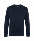 The B&C Collection BA010 is showcased against a white background, featuring a plain black crew neck design. This sweatshirt has long sleeves and boasts a simple, classic style with ribbed cuffs and hem.