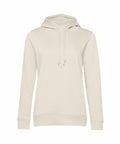 B&C Collection's BA01F, a simple beige hoodie featuring a drawstring hood, long sleeves, and a front pocket, is showcased against a white background.