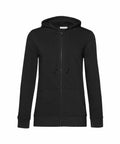 BA02F, a black zip-up hoodie from B&C Collection, features front pockets and drawstrings, set against a white background.
