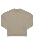 A solid light beige, long-sleeved crew neck sweatshirt with ribbed cuffs, collar, and waistband is laid flat on a white background. Product: Sweatshirts.
