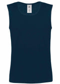 The BA110 from B&C Collection is a dark blue, plain, sleeveless tank top featuring a rounded neckline and a visible tag inside the collar area.