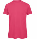 Displayed on a white background is the BA118 T-shirt by B&C Collection, featuring a plain, bright pink design with short sleeves and a crew neckline.
