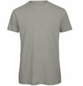A BA118 T-shirt by B&C Collection, in a plain light grey color, is displayed on a white background. This shirt features a classic crew neck and short sleeves, with no visible logos or designs.