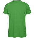 The BA118 t-shirt by B&C Collection in plain green, displayed against a white background.