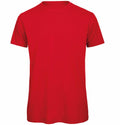 The BA118 by B&C Collection is a plain red T-shirt featuring short sleeves and a round neckline, shown from the front.