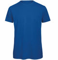 The BA118 by B&C Collection is a plain blue T-shirt featuring short sleeves and a round neckline, displayed on a white background.