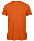 The BA118 from B&C Collection is an orange t-shirt set against a white background. It features a plain design with a crew neckline, short sleeves, and no visible logos or designs.