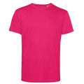 The BA212 by B&C Collection is displayed against a plain white background, showcasing the front view of the bright pink t-shirt. It features short sleeves and a round neckline.