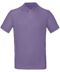 The BA260 by B&C Collection is a plain, short-sleeved purple polo shirt featuring a collar and three buttons down the front. The shirt is displayed against a white background.