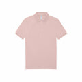 A light pink polo shirt from the B&C Collection, featuring short sleeves and a collar, displayed against a white background. The BA261 shirt includes a buttoned placket with three buttons.