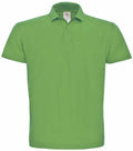 The BA306 polo shirt from B&C Collection, featuring a plain green color, standard collar, and short sleeves, is showcased against a white background. The fabric looks soft, and the shirt includes a buttoned placket.