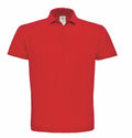 The BA306 from B&C Collection is a plain red polo shirt shown against a white background. It includes a classic collar, short sleeves, and a single button placket.
