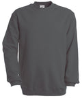 The BA401 by B&C Collection is a soft and comfortable plain dark gray sweatshirt featuring long sleeves and a crew neck, displayed against a white background, ideal for casual wear.