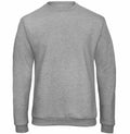 A B&C Collection BA409 crewneck sweatshirt in plain grey, featuring long sleeves and showcased on a white background. The fabric looks soft and comfortable, ideal for casual wear.