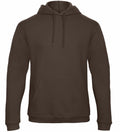 Introducing the BA411 by B&C Collection: a plain dark brown hoodie featuring a front pocket and drawstring hood, showcased against a clean white background.