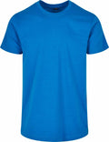 A plain blue T-shirt from Build Your Brand Basic's BB010 collection is displayed on a white background. It features a round neckline and short sleeves, with no visible design or logos.