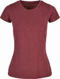 A Build Your Brand Basic BB012 T-shirt, featuring a plain maroon color with short sleeves, is showcased against a white backdrop. The T-shirt has a crew neck and a fitted shape, crafted from soft fabric.