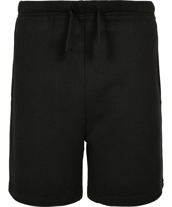 The Kids basic sweat shorts by Build Your Brand Basic are plain black, made from soft fabric, and feature an elasticated waistband with a front drawstring, displayed against a white background.