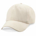 The Beechfield BC010 is a beige baseball cap featuring a curved brim and an adjustable strap at the back.