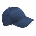 The BC015 by Beechfield is showcased against a white backdrop. It is a plain dark blue baseball cap with a curved brim and ventilation holes on the side panels.