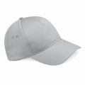 The Beechfield BC015 baseball cap is displayed at a slight angle against a white background, showcasing its light gray color with a curved brim and two ventilation holes on each side.