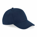 A Beechfield BC018 baseball cap in dark blue featuring a curved brim and a button on top, showcased from the side against a white background.