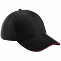 A Beechfield BC020, a black baseball cap featuring a curved brim with a subtle red edge on the underside.