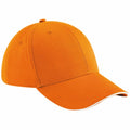 A Beechfield BC020 baseball cap in orange, featuring a curved brim and six panels.