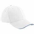 Introducing the Beechfield BC020 cap—a white baseball cap featuring a classic six-panel design. It boasts a curved brim with the added style of a thin blue accent line along its edge, and is worn at a slight angle for that perfect look.