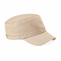 The BC034 by Beechfield is a beige military-style cap featuring a smooth fabric, a flat top, and a short, curved brim with subtle stitching details.