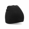 The Beechfield BC044 is a black knit beanie shown against a plain white background. It looks thick and cozy, making it ideal for cold weather. Its simple, classic design indicates both versatility in fashion and practical warmth.