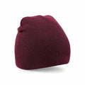 Beechfield BC044 maroon knitted beanie hat placed against a plain white background.