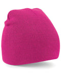 The Beechfield BC044 knit beanie is displayed against a white background. It has a bright pink color, features a folded edge, and boasts a smooth, textured appearance.