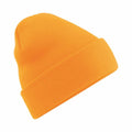 Beechfield's BC045 bright orange knit beanie with a fold-over brim, showcased against a white background.
