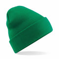 The Beechfield BC045 beanie, featuring a folded cuff and knit texture in green, is displayed at an angle against a white background to showcase its simple design.