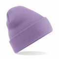 A purple knit beanie, model BC045 by Beechfield, is displayed on a white background. It features a soft, ribbed texture with a folded brim and boasts a simple, classic design.
