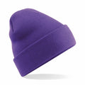 A Beechfield BC045 in a vibrant purple hue, featuring a knit design with a folded cuff, is displayed against a white backdrop, giving it an impression of floating for a clean and minimalist look.