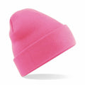 A Beechfield BC045, a pink knitted beanie with a folded brim, is displayed against a plain white background.