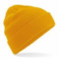 A BC050 bright yellow knitted beanie with a folded brim from Beechfield, displayed against a white background.