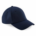 Introducing the Beechfield BC059, a stylish navy blue baseball cap featuring a curved brim and a button on top. Crafted with stitched panels and eyelets, this cap ensures optimal ventilation.