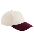 The Caps baseball cap features a cream-coloured crown and a dark red brim, displayed on a plain white background.
