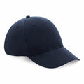 A navy blue baseball cap by Beechfield, model BC070, featuring stitching details on the brim and panels.