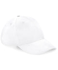 The BC070 from Beechfield is a plain white baseball cap that features a curved brim and six panels, along with ventilation eyelets on top. It is shown positioned at an angle to display both the front and side views.
