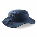 The Beechfield BC088, a blue bucket hat featuring eyelets and an adjustable strap, is displayed against a white background.