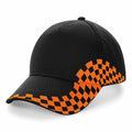 A Beechfield BC159 baseball cap featuring a black design with an orange checkered pattern on the brim and side.