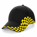 Introducing the Beechfield BC159: a black baseball cap accentuated with a striking yellow checkered pattern on the front and sides. This stylish hat also features a curved brim and ventilation eyelets on top.