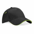 The BC15C by Beechfield is a black baseball cap with a curved brim that includes green accents along the edge, along with two small green eyelets on the side for ventilation.
