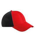 A side view of a Caps baseball cap with a solid red front and peak, black back panels featuring ventilation holes, a curved visor, and visible stitching.